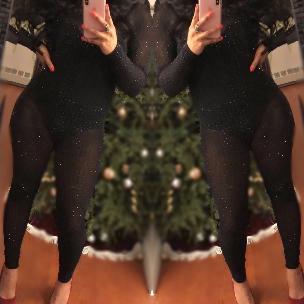 Sheer studded black catsuit.